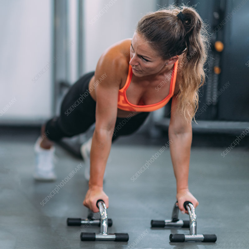 A Black female athlete with a muscular 